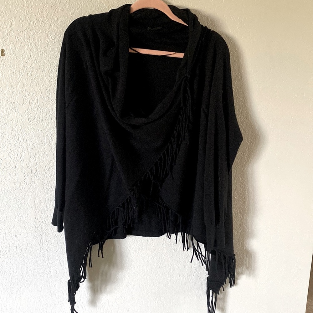 Poncho with sleeves.